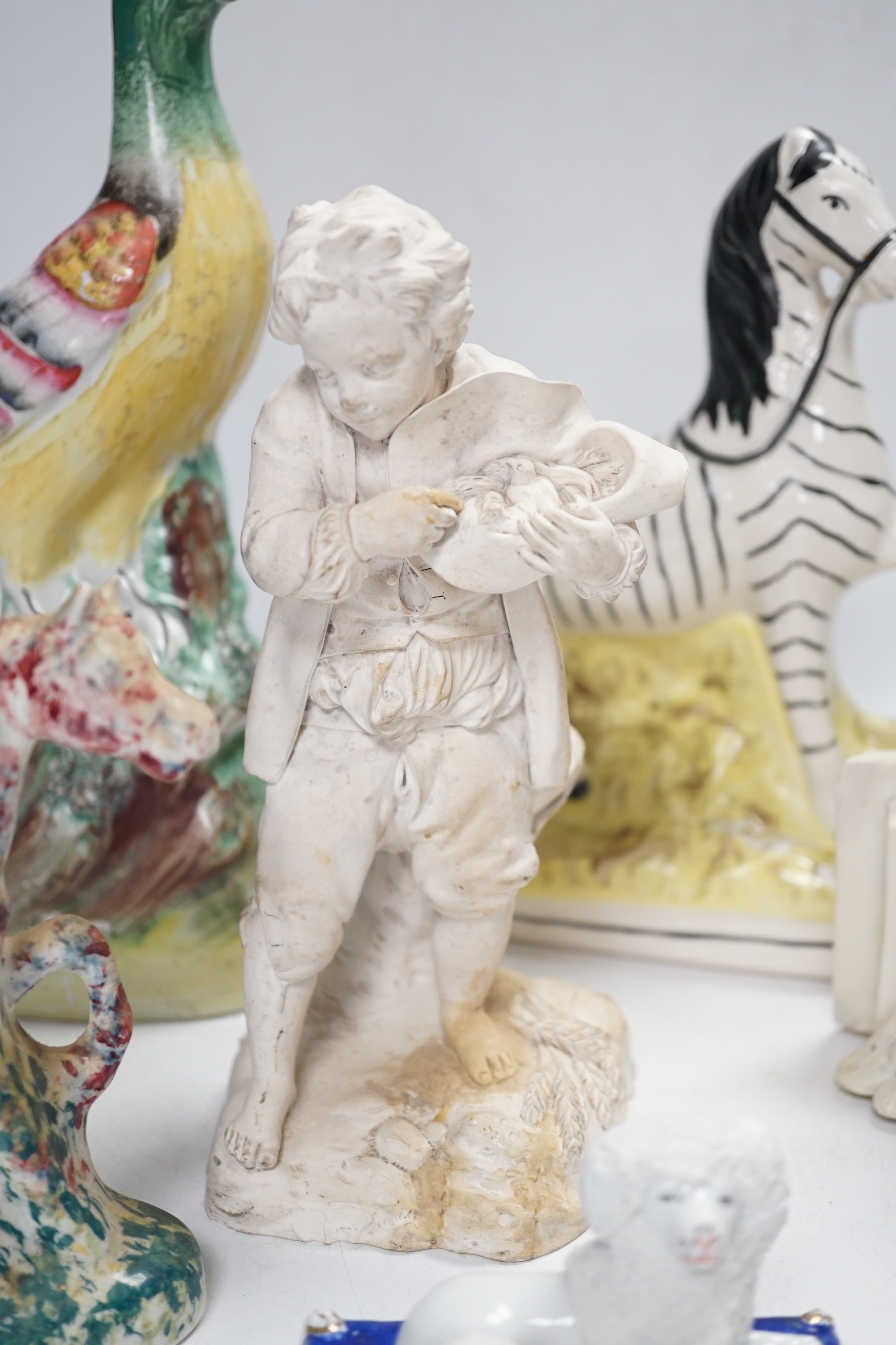 A Staffordshire spongeware rider on horseback, a Staffordshire pheasant, and three other items, pheasant 26cm